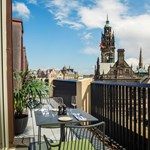 A rooftop terrace overlooking Sheffield Town Hall.