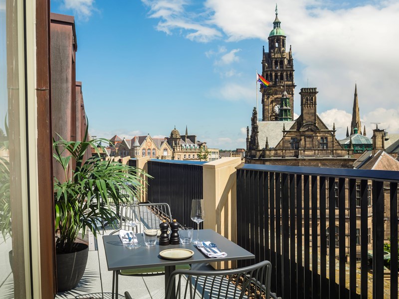 A rooftop terrace overlooking Sheffield Town Hall.