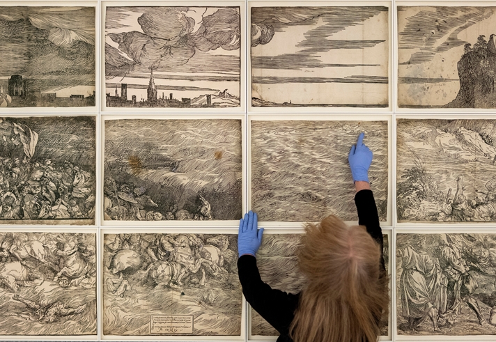 Penny McCarthy with Titian's The Submersion of Pharaoh’s Army in the Red Sea (c. 1549), How to Look Through Time © the artist. Photo: Hugo Glendinning