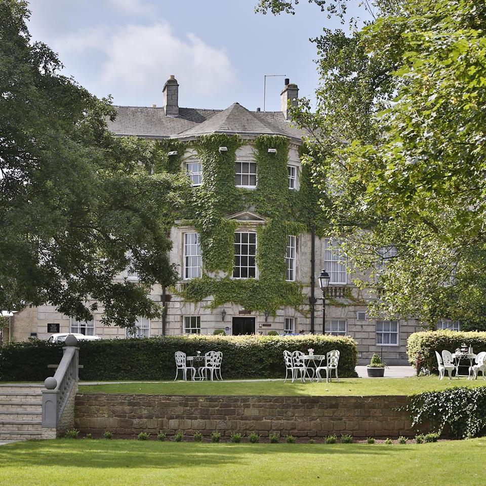 Historic Aston Hall Hotel set among mature trees and well-maintained grounds.