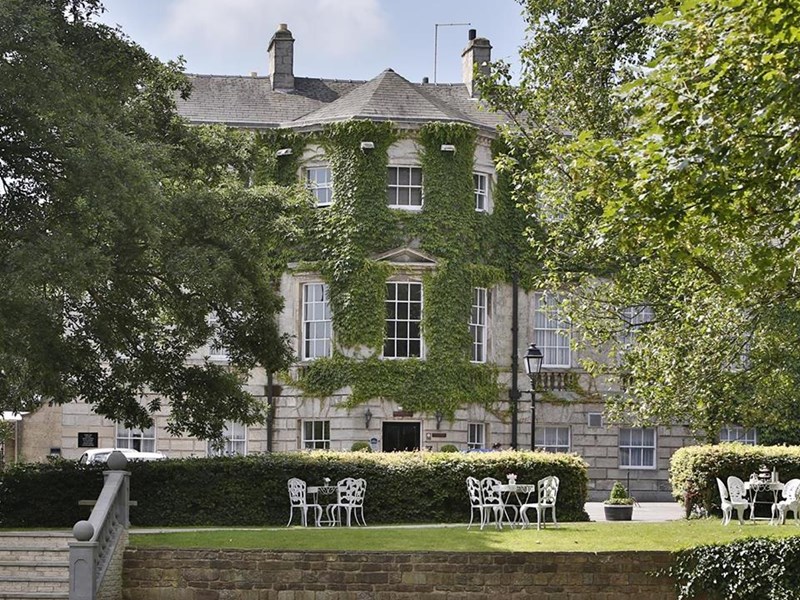 Historic Aston Hall Hotel set among mature trees and well-maintained grounds.