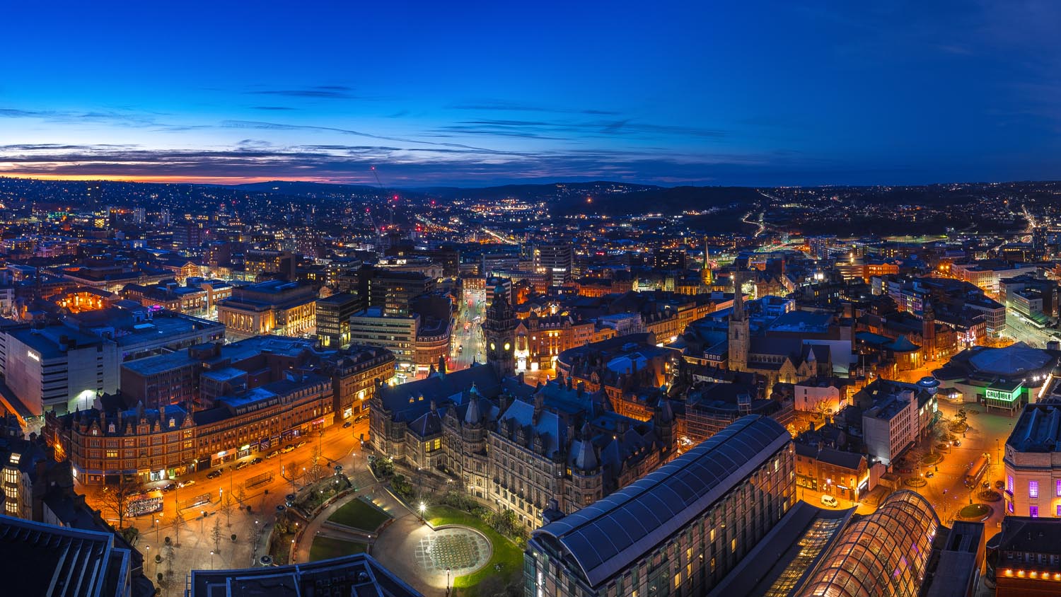 A panorama shot of the Sheffield skyline at night.