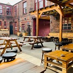 The courtyard at Yellow Arch, with tables and chairs.
