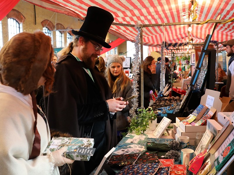 People dressed in Victorian attire at the Kelham Island Museum festive market