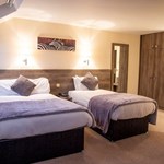 A hotel room with two beds.