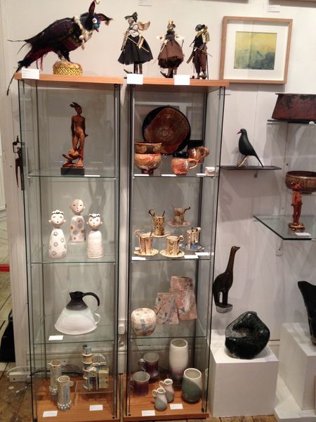 A display case filled with small pieces at Cupola Gallery.