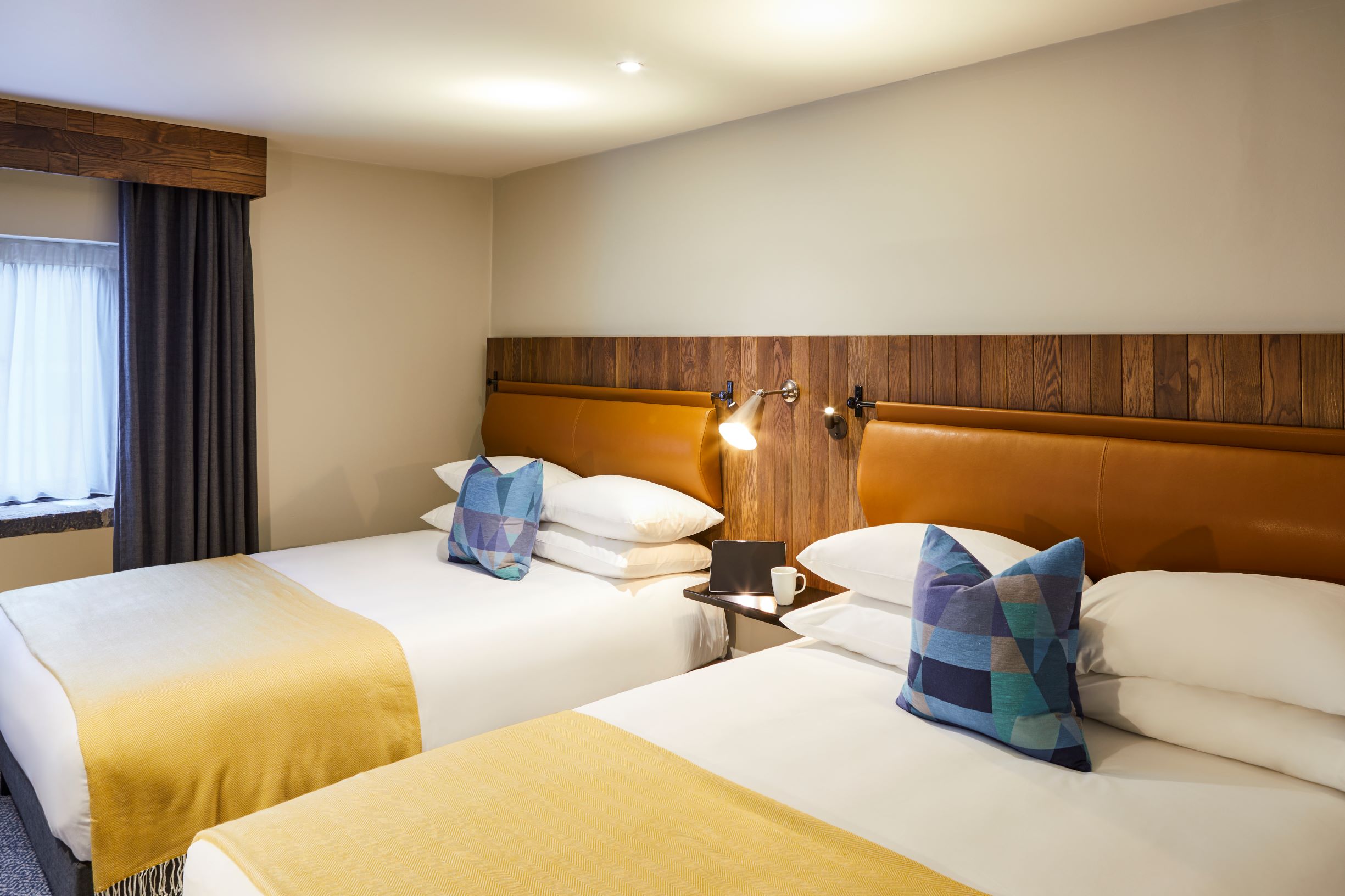 Twin bedroom at Mercure Tankersley Manor with two single beds, bedside tables, and soft lighting.